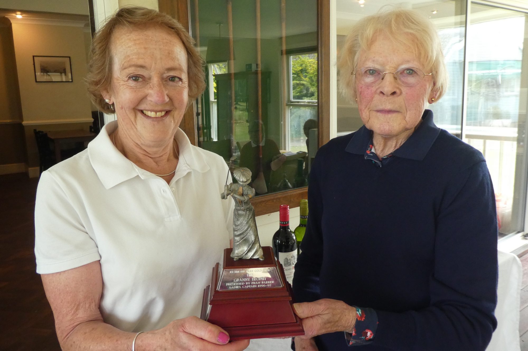Hillary Sutton being presented with her prize by Ladies Captain, Cherrie Lawn.